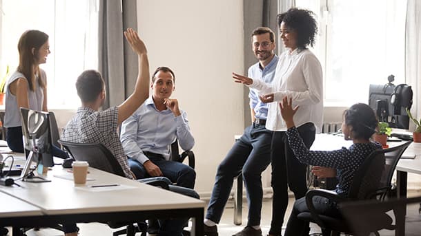 Happy employees in office setting